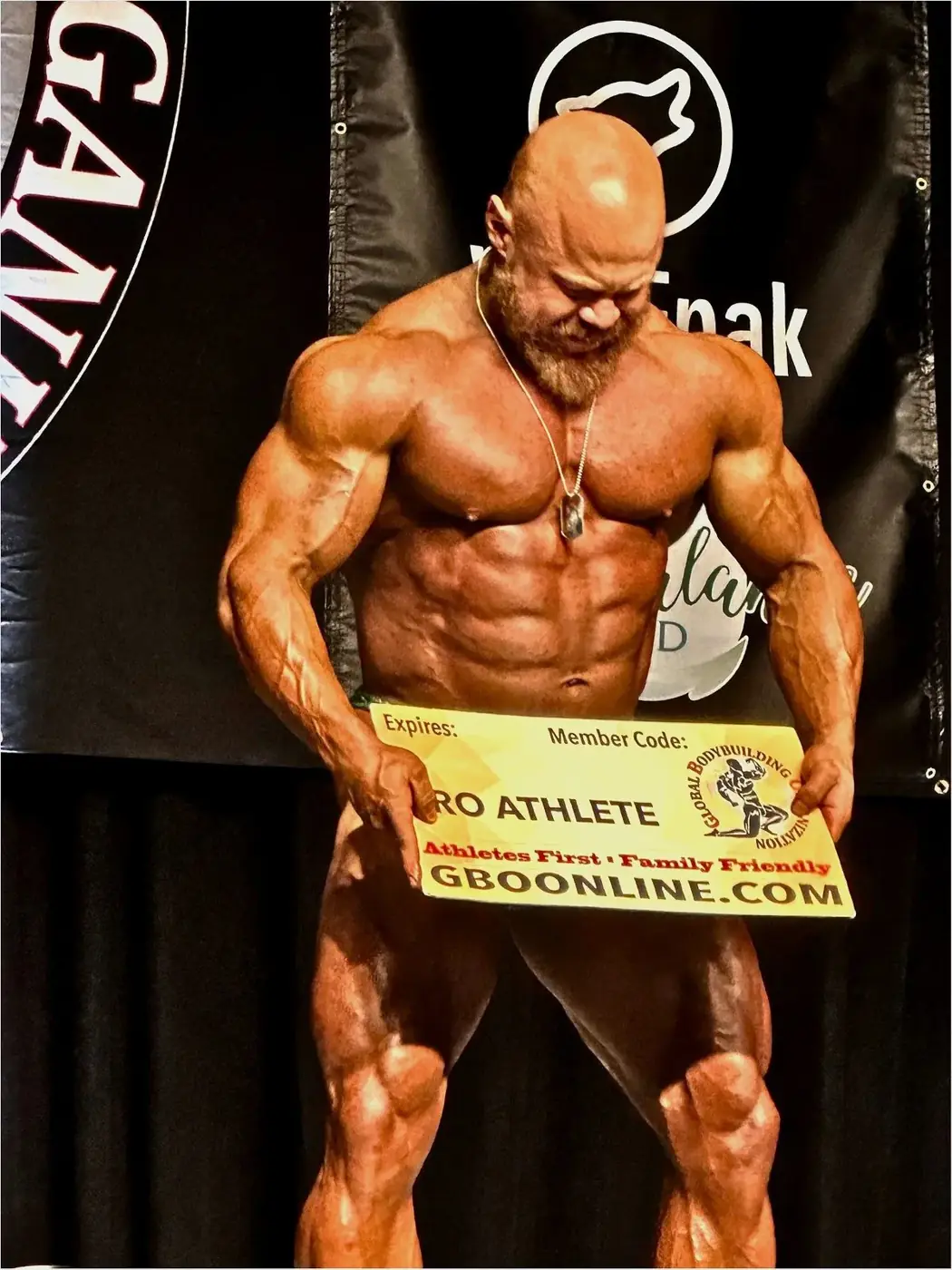 Tyler B. holding GBO Pro Athlete card